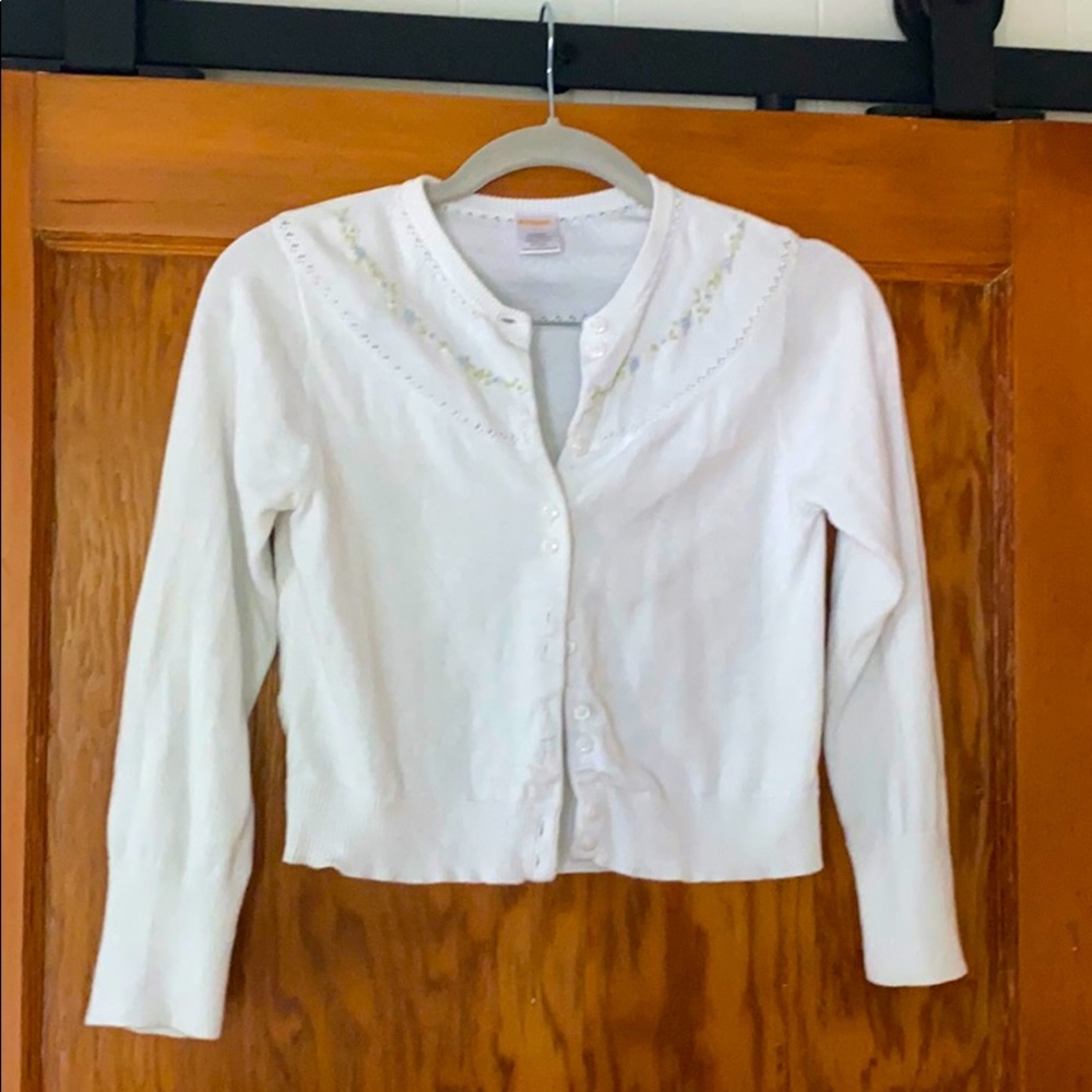 Child’s white cardigan